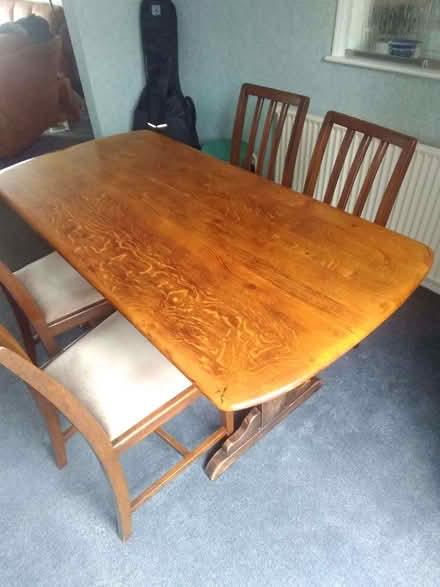 Photo of free Ercol solid oak table with 4 chairs of unknown make (Burncross S35) #1