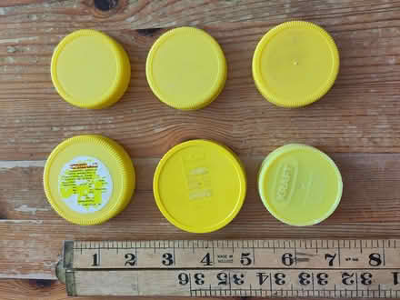Photo of free Yellow plastic lids from marmite jars - junk modelling? (Henleaze Ward BS9) #1