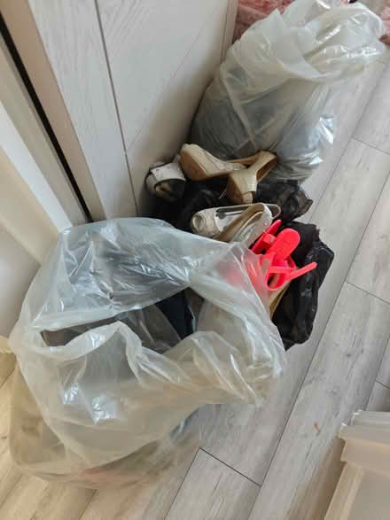Photo of free Two bags of male clothes, plus a couple of high heels pairs. (Welling DA16) #1