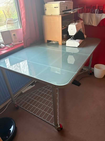 Photo of free Large Glass IKEA Desk on Wheels (Boreham Street BN27) #1