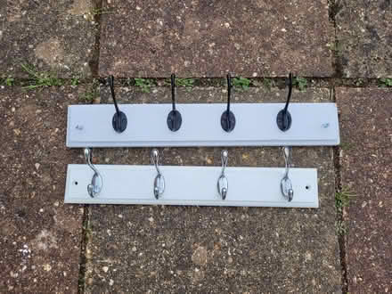 Photo of free Coat hanging hooks on a wooden rail (Rayner's Lane HA2) #1