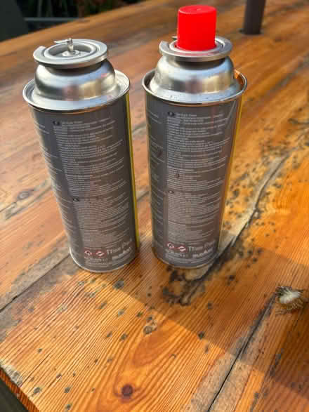 Photo of free Four butane gas canisters 227g each (Comberton DY10) #2