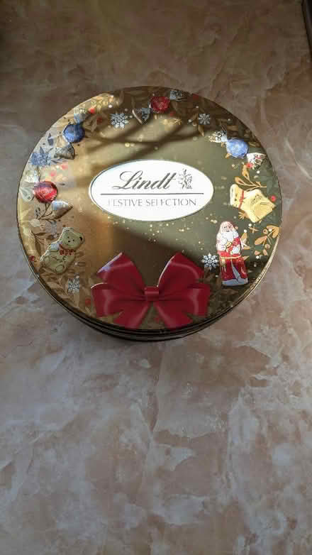 Photo of free Empty lindt tin and Wallace & Grommit PG tips tea caddy (Caldy Valley CH3) #1