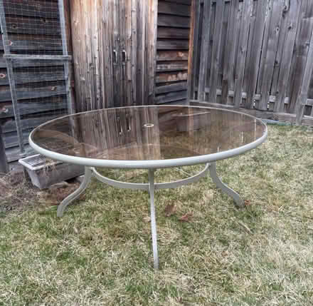 Photo of free Round glass & metal patio table (Prince of Wales at Meadowlands) #1