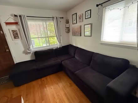 Photo of free Black L shaped couch (Woodlawn) #1