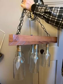 Photo of free reclaimed wine bottle chandelier (Lowell and highland) #1