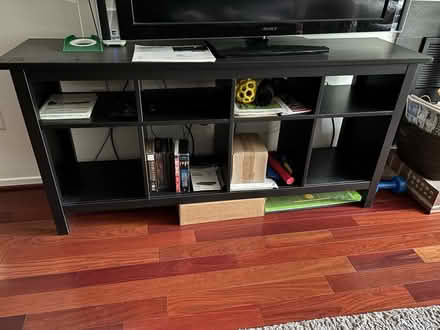 Photo of free Tv stand dark wood (Reston, VA) #1