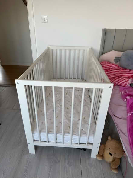 Photo of free IKEA baby bed with mattress (Barking Riverside IG11) #1