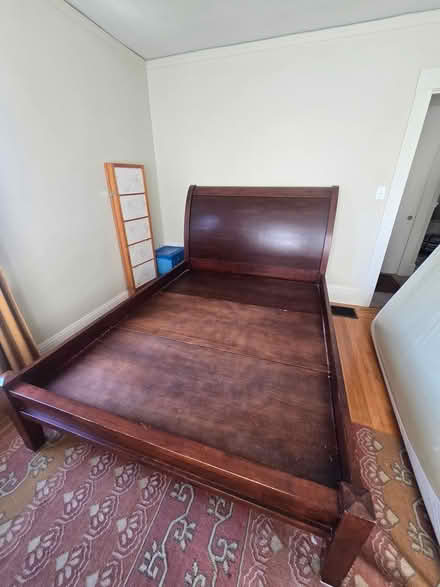 Photo of free Queen size sleigh bed (on curb) (On Barrett been Tuller/Brooks) #1