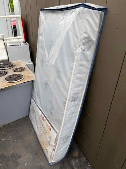 Photo of free Sealy crib and toddler mattress (1075 Valencia Avenue) #1