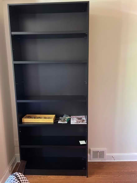 Photo of free Very tall heavy black bookcase (Chevy Chase DC) #1