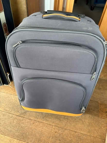 Photo of free Orange and black carry on suit case (Penrith CA11) #1