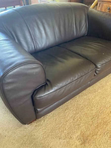 Photo of free Brown leather 2 seater settee. (Cockermouth CA13) #1