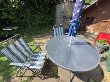 Photo of free Glass top round table, 2 fold up chairs, parasol & cover (Davenham CW9) #1