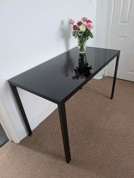 Photo of free Table with black glass top. Black metal legs. Excellent cond (Bedlington Station NE22) #1