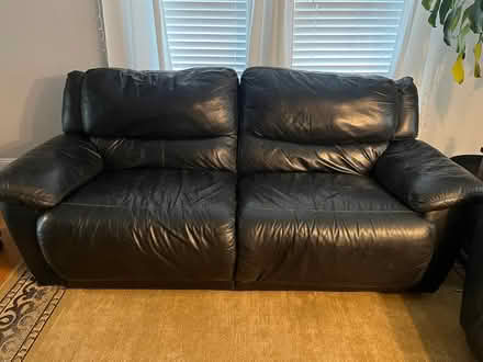 Photo of free Black leather reclining loveseat (East Bridgewater) #1
