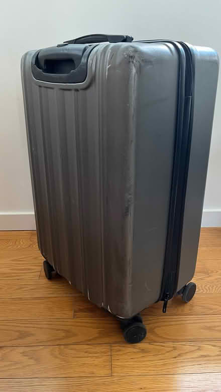 Photo of free Tripp - hard-shell dark grey suitcase (Tooley Street SE1) #1