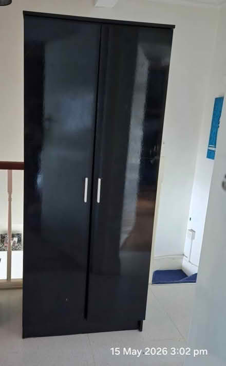 Photo of free Tall black hi gloss cupboard (Northfield Ealing) #1