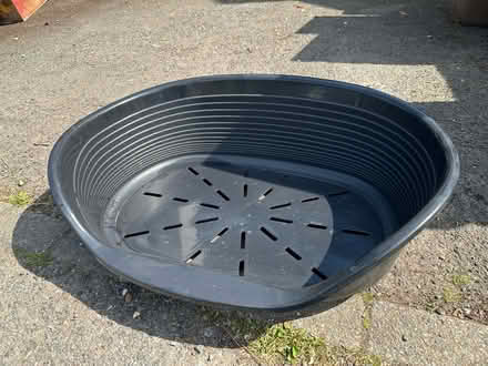 Photo of free Black plastic dog bed - medium-sized, 65x24cm (Radlett WD7) #1