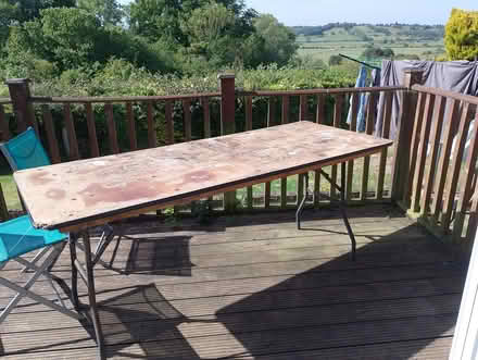 Photo of free Outside table. 6 foot long. Legs fold in. Sturdy. Ideal for (Icklesham TN36) #1