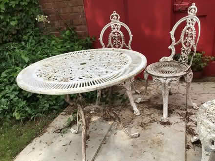 Photo of free Cast iron table and 2 chairs (EX3 topsham) #1