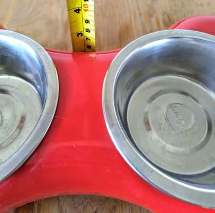 Photo of free Red plastic and stainless steel dog bowl set (Macclesfield SK11) #1