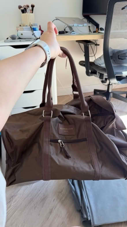 Photo of free Brown duffel bag (The Exchange LS12) #1