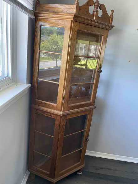 Photo of free Oak Corner Cabinet w/ Glass Shelves (Near Parkville High School) #2