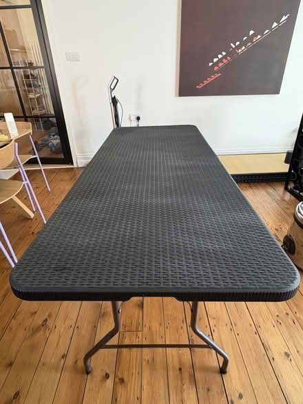 Photo of free 6ft black foldable table (Lower Clapton E5) #1