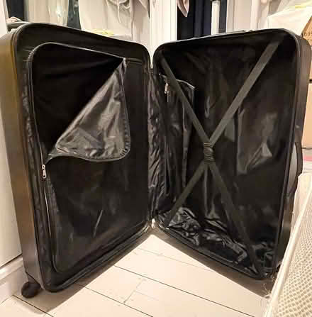 Photo of free Large, black, hard shell suitcase (Custom House E16) #3