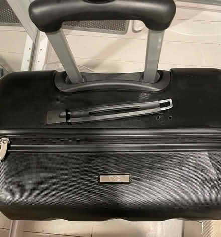 Photo of free Large, black, hard shell suitcase (Custom House E16) #2