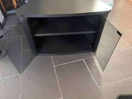 Photo of free Black TV stand with glass doors (Blackpool) #2
