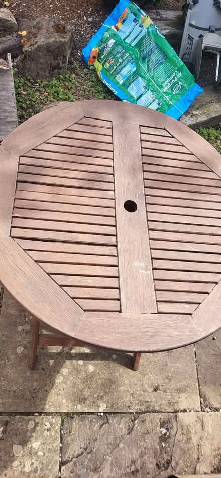 Photo of free Round wooden garden table (Fairfield Park SG5) #1