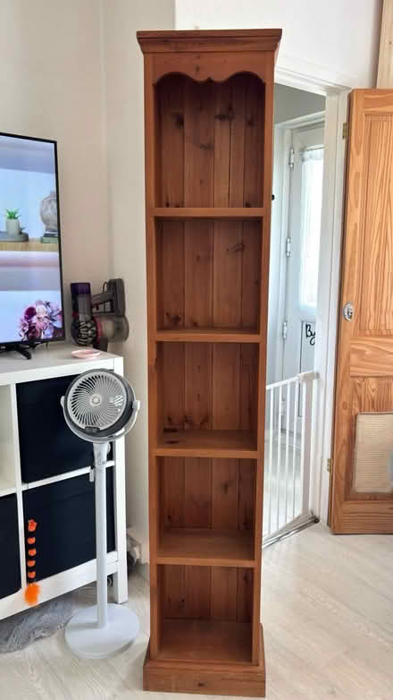 Photo of free Tall narrow pine bookcase (Hastings TN35) #1