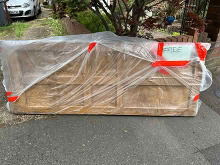 Photo of free Interior pine door w/ brass handle (Worton TW7) #1
