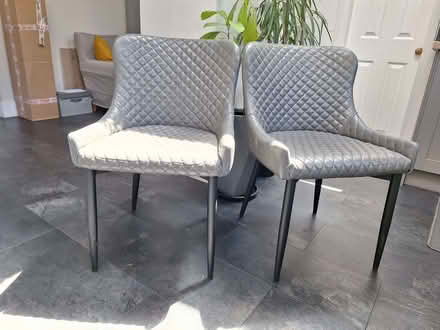 Photo of free 2 x dining chairs. Grey faux leather. No rips or tears. (Hampden Park BN22) #1