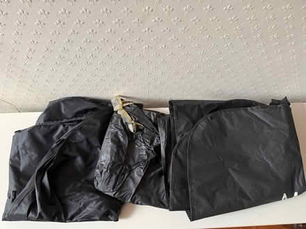 Photo of free Three black plastic suit carriers (Salford M30) #1