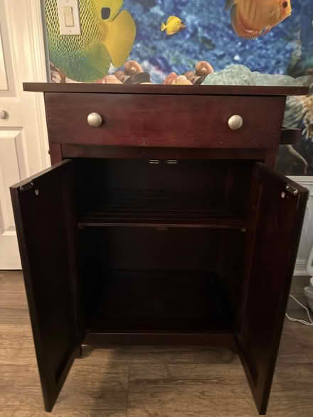Photo of free Wheeled Wood Cabinet (Land o Lakes) #1