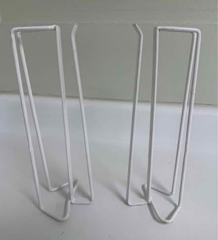 Photo of free 2 metal suspension shelf racks (1075 Valencia Avenue) #1