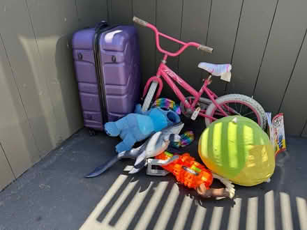 Photo of free Toys, kid’s bike, suitcase (1075 Valencia Avenue) #1