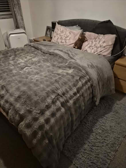 Photo of free Grey material kingsize bedframe (Claygate) #1