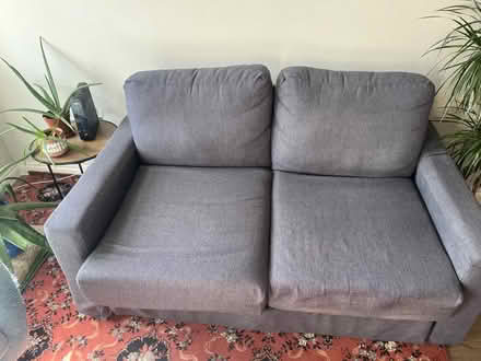 Photo of free Two-seater grey fabric sofa (SE14 new cross) #1