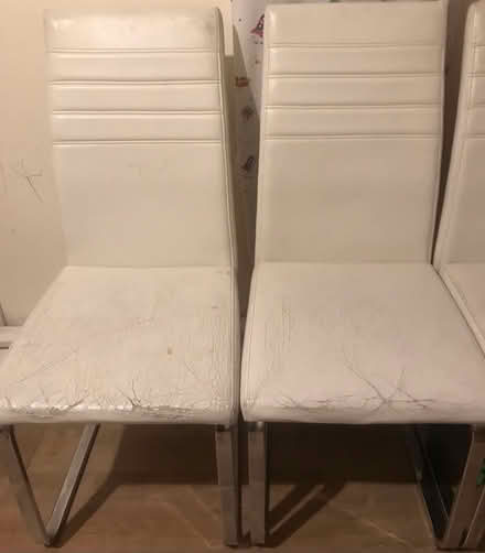 Photo of free 4 cream faux leather dinner chairs (Epsom KT18) #1