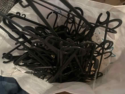 Photo of free Bag of black plastic hangers (Paddington W2 6) #1
