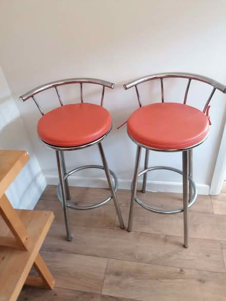 Photo of free 2 metal bar stools with wooden seats and orange seat pads. (Highams Park E4) #1