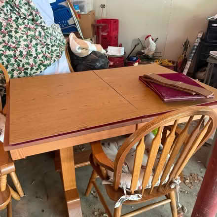 Photo of free Solid oak table with 4 leaves (North Aurora) #1