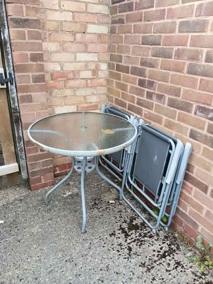 Photo of free out door round metal table with glass middle and 4 chairs (Monkmoor SY2) #1