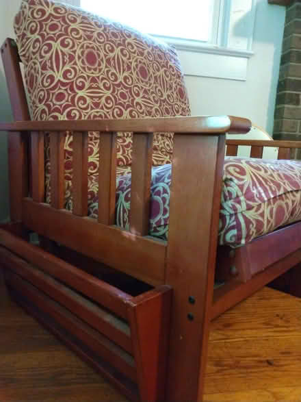 Photo of free Futon chair with magazine holder (West Boone) #1