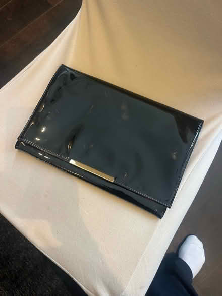 Photo of free Black patent clutch bag with red lining (Lavender Hill SW11) #1