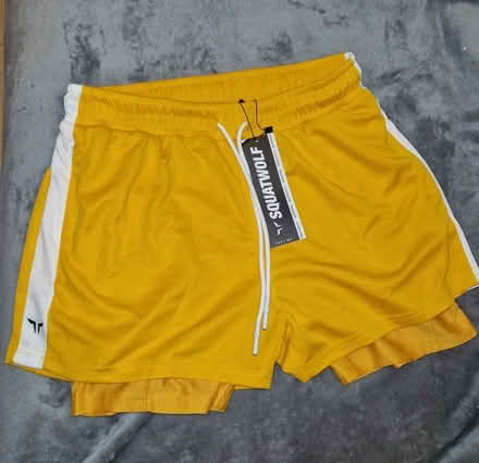 Photo of free Men's exercise shorts yellow size M (Stepney E1) #1